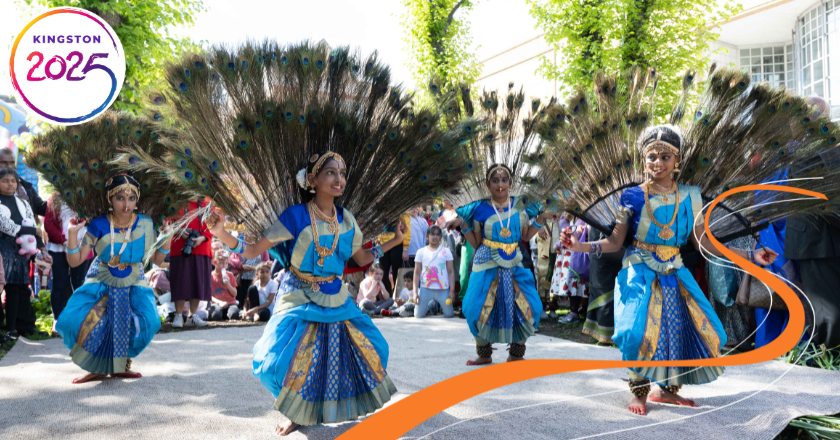 Girls dancing in peacock-style dresses with feathers