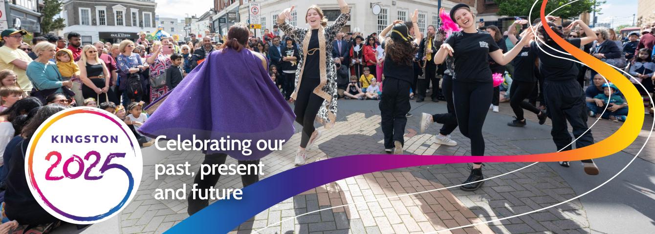 Women dancing in Kingston watched by crowds