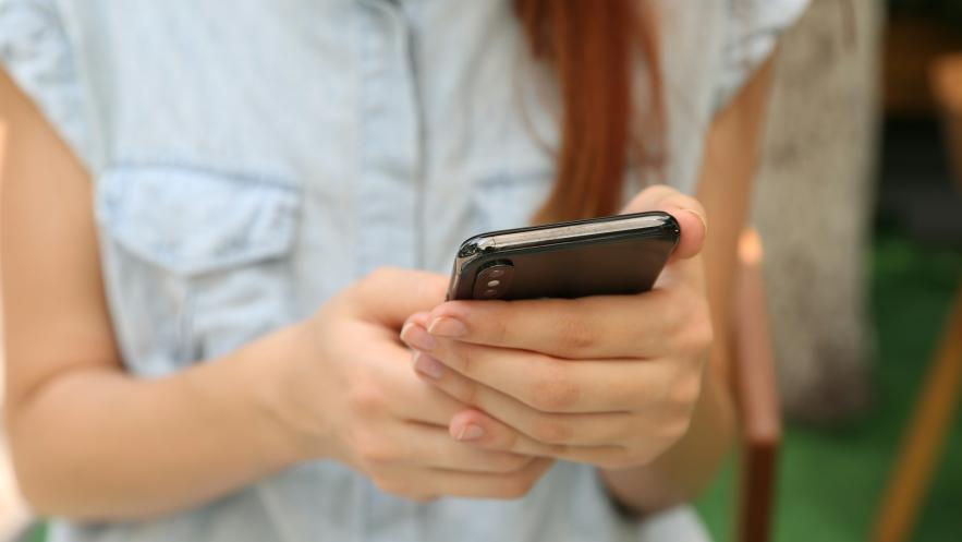 Close up of someone using their mobile phone